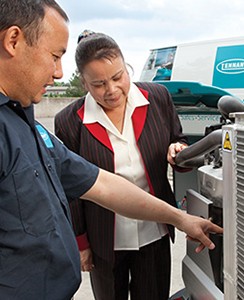 jansan employee working with client on machine showing how to maintain equipment